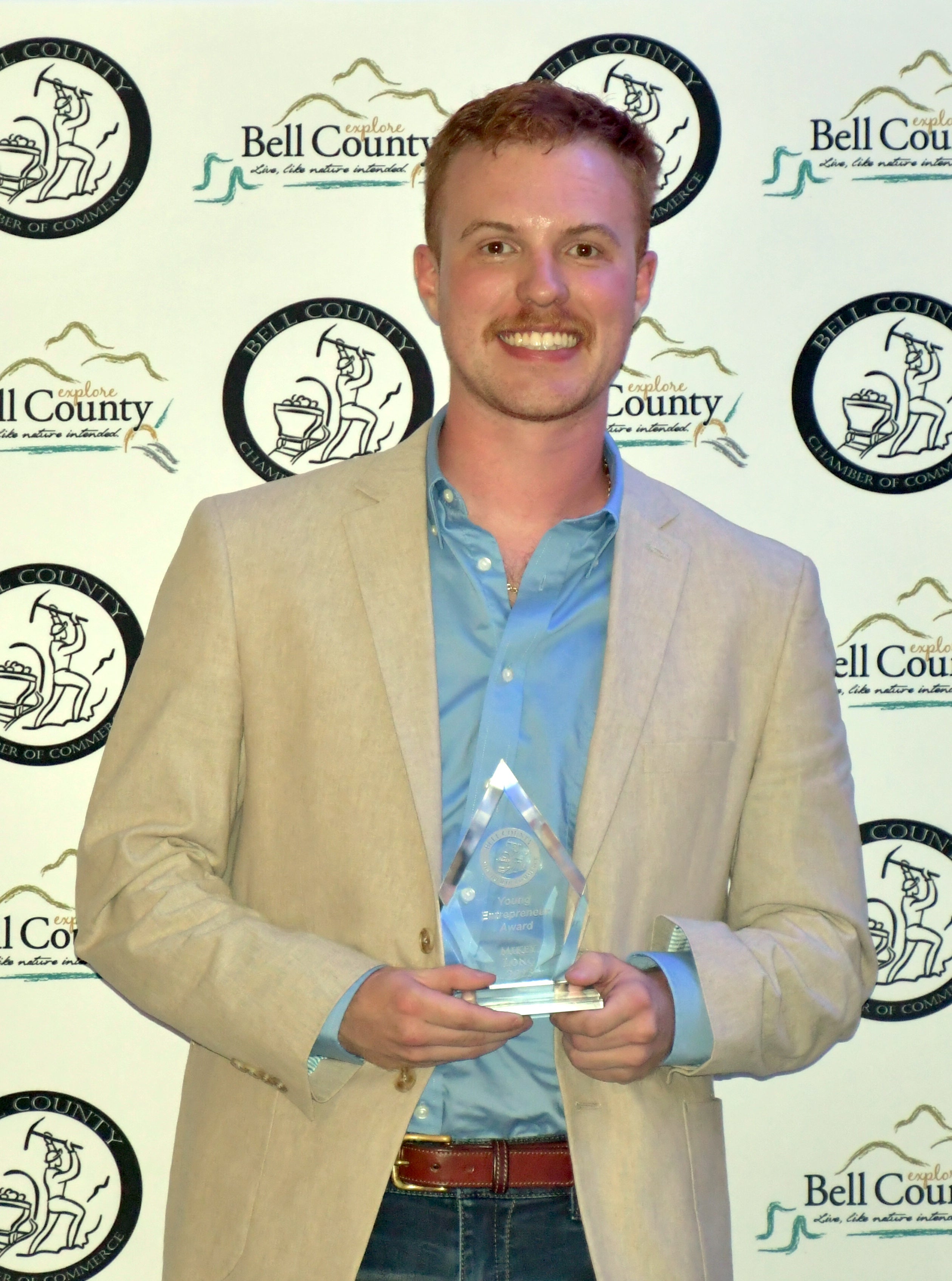 YOUNG ENTREPRENEUR OF THE YEAR AWARD WINNER MIKEY LONG OF LONG'S PIC PAC