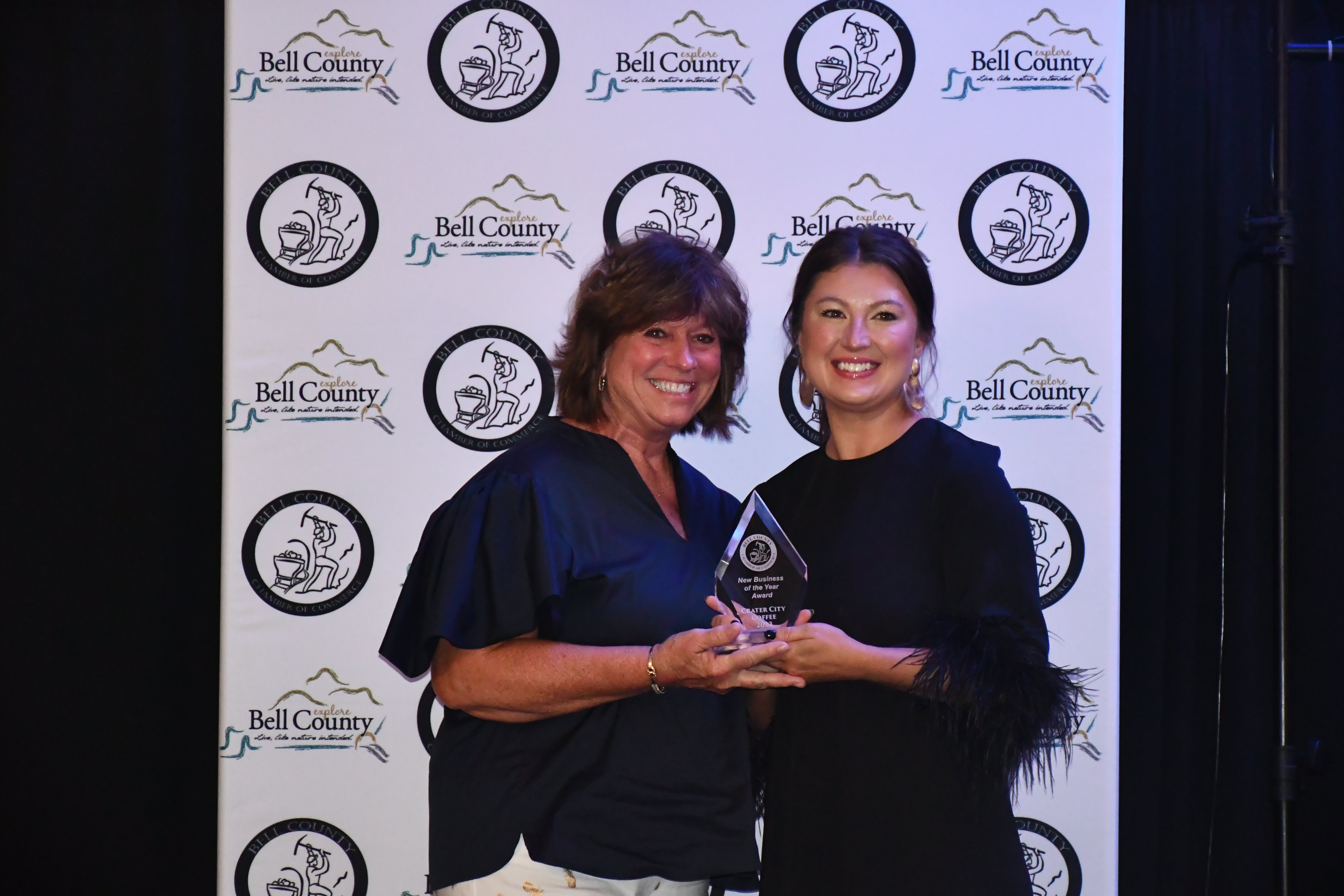 NEW BUSINESS OF THE YEAR WINNER CRATER CITY COFFEE (LEFT) WITH CHAMBER OF COMMERCE DIRECTOR MELISSA TURNER (RIGHT)